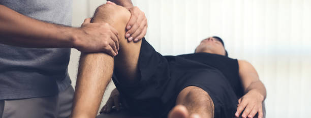 Manual therapy applied to a patient's knee