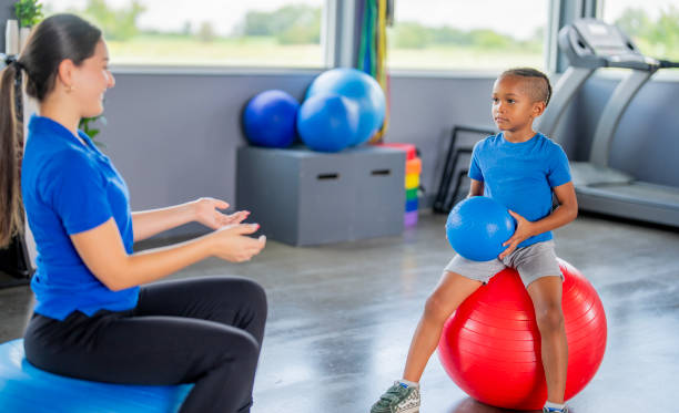 Pediatric therapy session with a stability ball