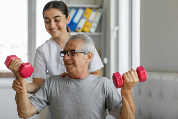 Senior patient working with light dumbbells