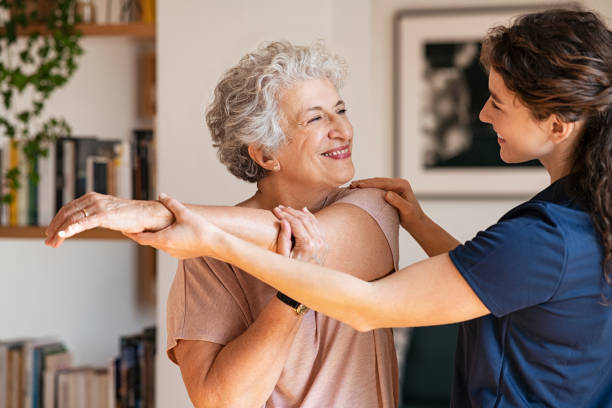 Senior patient stretching with therapist support